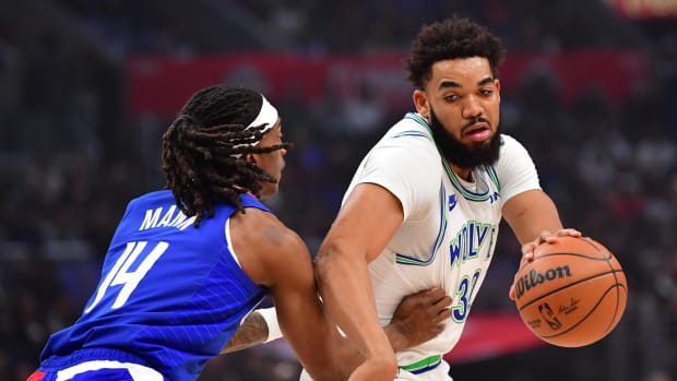 Minnesota Timberwolves center Karl-Anthony Towns and Los Angeles Clippers guard Terance Mann 