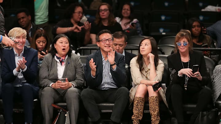 May 9, 2019; New York City, NY, USA; Taiwanese businessman Joe Tsai (center) cheers during the second half of the preseason WNBA game between the New York Liberty and the China National Team at Barclays Center. Mandatory Credit: Vincent Carchietta-Imagn Images