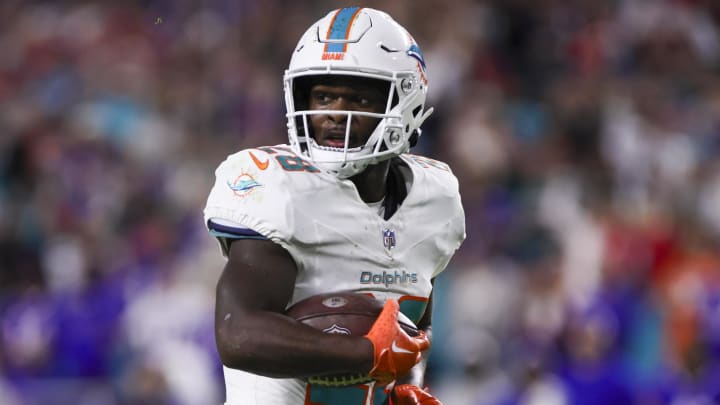 Jan 7, 2024; Miami Gardens, Florida, USA; Miami Dolphins running back De'Von Achane (28) runs with the football for a touchdown against the Buffalo Bills during the second quarter at Hard Rock Stadium. Mandatory Credit: Sam Navarro-USA TODAY Sports