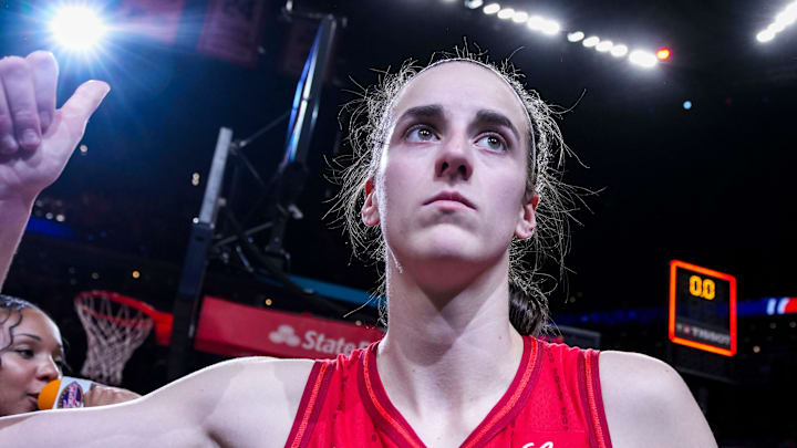 Indiana Fever guard Caitlin Clark (22) gives a thumbs up to fans after an interview Sunday, Sept. 8, 2024, during a game between the Indiana Fever and the Atlanta Dream at Gainbridge Fieldhouse in Indianapolis. The Fever defeated the Dream in overtime, 104-100.