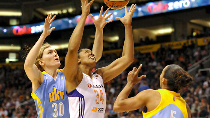 May 27, 2013; Phoenix, AZ, USA; Chicago Sky center Carolyn Swords (30) and Phoenix Mercury center Krystal Thomas (34) battle for the ball during the second quarter at US Airways Center. Mandatory Credit: Casey Sapio-Imagn Images