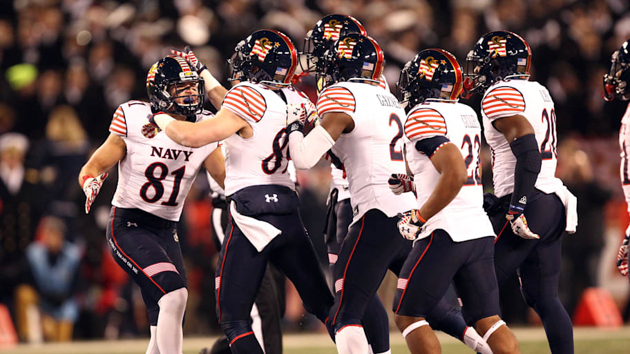 Navy players celebrate a play during the 2014 Army-Navy Game.