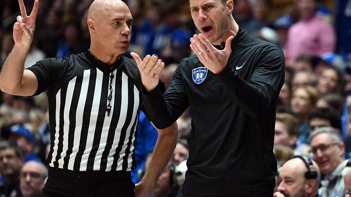 Feb 14, 2026; Durham, North Carolina, USA; Duke Blue Devils head coach Jon Scheyer (right) argues with an official during the first half against the Clemson Tigers at Cameron Indoor Stadium.