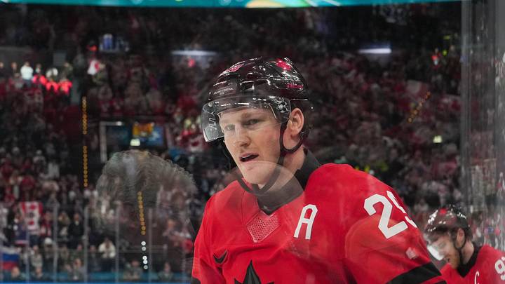 Feb 20, 2026; Milan, Italy; Nathan MacKinnon (29) of Canada celebrates after scoring a goal during the third period against Finland in a men's ice hockey semifinal during the Milano Cortina 2026 Olympic Winter Games at Milano Santagiulia Ice Hockey Arena. Mandatory Credit: James Lang-Imagn Images