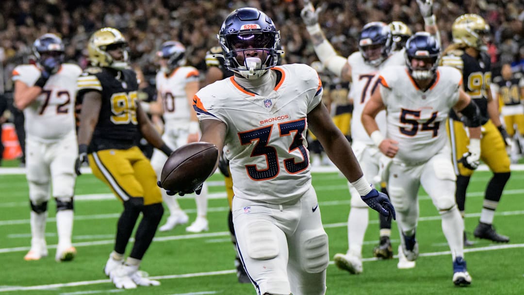Oct 17, 2024; New Orleans, Louisiana, USA; Denver Broncos running back Javonte Williams (33) scores a touchdown against the New Orleans Saints during the second quarter at Caesars Superdome. 