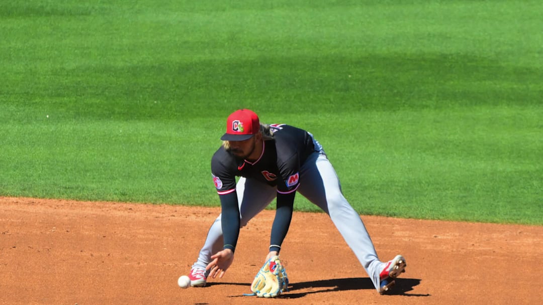 Feb 27, 2026; Mesa, Arizona, USA; Cleveland Guardians shortstop Gabriel Arias (13) fields a ball as part of a double play in the third inning against the Chicago Cubs at Sloan Park. Mandatory Credit: Matt Kartozian-Imagn Images