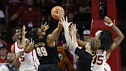 Feb 1, 2025; Norman, Oklahoma, USA; Vanderbilt Commodores forward Devin McGlockton (99) fights for control of the ball against Oklahoma Sooners forward Mohamed Wague (5) and forward Glenn Taylor Jr. (35) during the first half at Lloyd Noble Center. Mandatory Credit: Alonzo Adams-Imagn Images