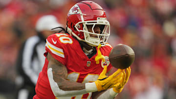 Jan 18, 2025; Kansas City, Missouri, USA; Kansas City Chiefs running back Isiah Pacheco (10) reaches for a pass against the Houston Texans during the first quarter of a 2025 AFC divisional round game at GEHA Field at Arrowhead Stadium. Mandatory Credit: Jay Biggerstaff-Imagn Images