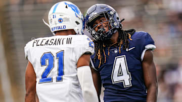 Sep 28, 2024; East Hartford, Connecticut, USA; Connecticut Huskies wide receiver Jasaiah Gathings (4) reacts after an interference call against cornerback Eddie Pleasant III (21) in the second quarter at Rentschler Field at Pratt & Whitney Stadium. Mandatory Credit: David Butler II-Imagn Images