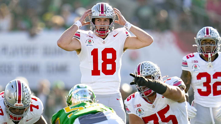 Ohio State Buckeyes quarterback Will Howard motions at the line of scrimmage during the College Football Playoff quarterfinal against the Oregon Ducks. Ohio State Buckeyes quarterback Will Howard motions at the line of scrimmage during the College Football Playoff quarterfinal against the Oregon Ducks.