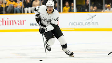 Nov 4, 2024; Nashville, Tennessee, USA;  Los Angeles Kings right wing Quinton Byfield (55) skates with the puck against the Nashville Predators during the second period at Bridgestone Arena. Mandatory Credit: Steve Roberts-Imagn Images