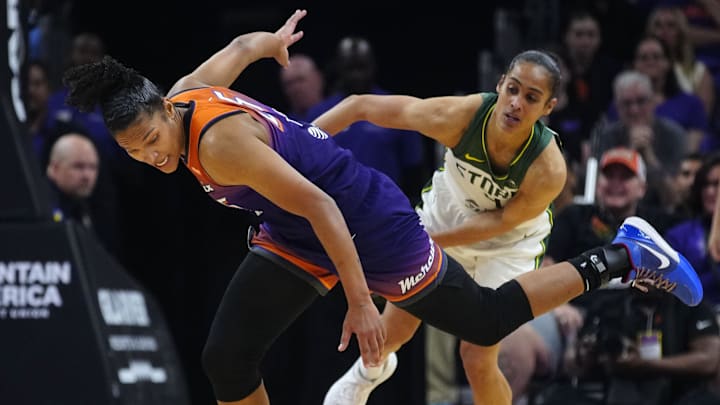 Seattle Storm guard Skylar Diggins (4) fouls Phoenix Mercury forward Alyssa Thomas (25) after a Thomas steal during the Mercury home opener in the PHX Arena in Phoenix on May 17, 2025.
