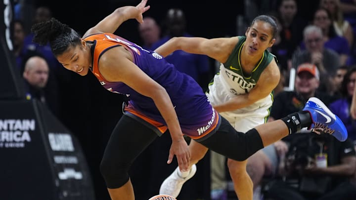Seattle Storm guard Skylar Diggins (4) fouls Phoenix Mercury forward Alyssa Thomas (25) after a Thomas steal during the Mercury home opener in the PHX Arena in Phoenix on May 17, 2025.