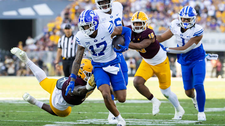 Nov 23, 2024; Tempe, Arizona, USA; Brigham Young Cougars wide receiver Keelan Marion (17) runs for a touchdown against the Arizona State Sun Devils in the second half at Mountain America Stadium. Mandatory Credit: Mark J. Rebilas-Imagn Images Nov 23, 2024; Tempe, Arizona, USA; Brigham Young Cougars wide receiver Keelan Marion (17) runs for a touchdown against the Arizona State Sun Devils in the second half at Mountain America Stadium. Mandatory Credit: Mark J. Rebilas-Imagn Images