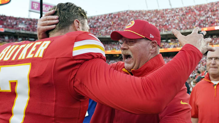 Butker celebrates with Chiefs coach Andy Reid after his game-winning field goal against the Bengals