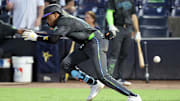 Tampa Bay Rays outfielder Chandler Simpson (14) hits a bunt single against the Baltimore Orioles during the fourth inning at George M. Steinbrenner Field.