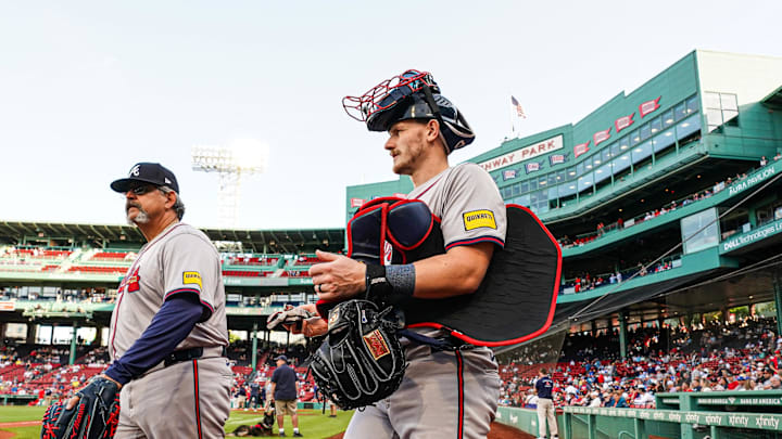 Jun 4, 2024; Boston, Massachusetts, USA; Atlanta Braves catcher Sean Murphy (12) and catching coach Sal Fasano (57) walk to the bullpen before the start of the game against the Boston Red Sox at Fenway Park. Mandatory Credit: David Butler II-USA TODAY Sports