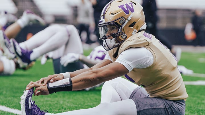 Demond Williams Jr. stretches out in UW practice. 