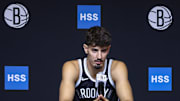 Sep 23, 2025; Brooklyn, NY, USA;  Brooklyn Nets guard Ben Saraf (77) speaks at Media Day. Mandatory Credit: Wendell Cruz-Imagn Images