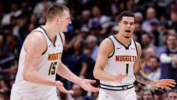 Mar 21, 2024; Denver, Colorado, USA; Denver Nuggets forward Michael Porter Jr. (1) and center Nikola Jokic (15) in the third quarter against the New York Knicks at Ball Arena. Mandatory Credit: Isaiah J. Downing-Imagn Images