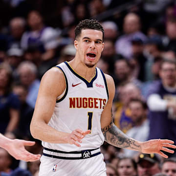 Mar 21, 2024; Denver, Colorado, USA; Denver Nuggets forward Michael Porter Jr. (1) and center Nikola Jokic (15) in the third quarter against the New York Knicks at Ball Arena. Mandatory Credit: Isaiah J. Downing-Imagn Images