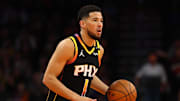 Nov 26, 2024; Phoenix, Arizona, USA; Phoenix Suns guard Devin Booker (1) against the Los Angeles Lakers during an NBA Cup game at Footprint Center. Mandatory Credit: Mark J. Rebilas-Imagn Images