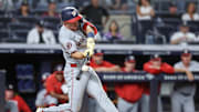 Aug 25, 2025; Bronx, New York, USA;  Washington Nationals center fielder Jacob Young (30) hits a grand slam home run in the ninth inning against the New York Yankees at Yankee Stadium. Mandatory Credit: Wendell Cruz-Imagn Images