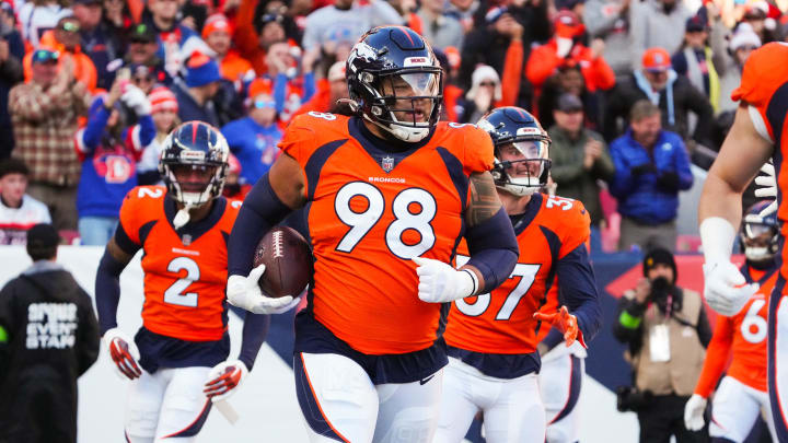 Nov 26, 2023; Denver, Colorado, USA; Denver Broncos defensive tackle Mike Purcell (98) following a defensive stop in the first quarter against the Cleveland Browns at Empower Field at Mile High. Mandatory Credit: Ron Chenoy-USA TODAY Sports