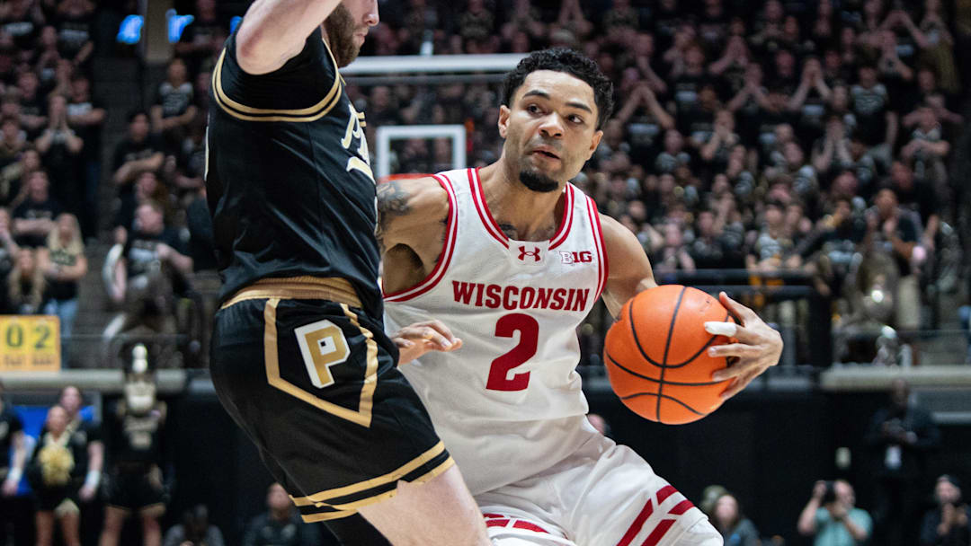 Mar 7, 2026; West Lafayette, Indiana, USA; Wisconsin Badgers guard Nick Boyd (2) drives to the basket as Purdue Boilermakers guard Braden Smith (3) defends during the first half at Mackey Arena. Mandatory Credit: Jacob Musselman-Imagn Images