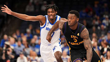 Memphis' PJ Carter (7) guards East Carolina's RJ Felton (3) as he drives to the basket during the game between East Carolina University and University of Memphis at FedExForum in Memphis, Tenn., on Saturday, January 11, 2025.