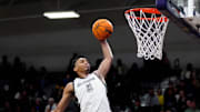 Millennium forward Cameron Holmes (3) dunks against Sunnyslope during a game at Millennium High School in Goodyear on Jan. 23, 2025.