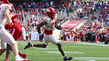 Oct 18, 2025; Houston, Texas, USA; Arizona Wildcats wide receiver Tre Spivey (12) runs the ball in for a touchdown during the fourth quarter against the Houston Cougars at TDECU Stadium. Mandatory Credit: Maria Lysaker-Imagn Images 