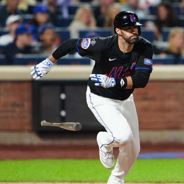 New York Mets designated hitter JD Martinez (28) runs out an RBI double against the San Diego Padres during the third inning at Citi Field.