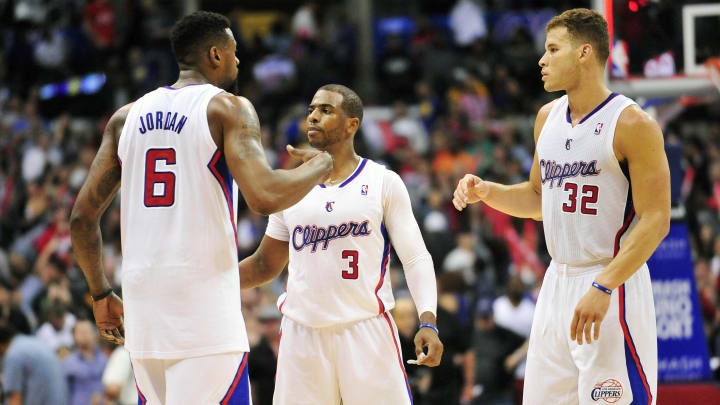 March 12, 2014; Los Angeles, CA, USA; Los Angeles Clippers center DeAndre Jordan (6), guard Chris Paul (3) and forward Blake Griffin (32) celebrate the 111-98 victory against the Golden State Warriors following the second half at Staples Center. 