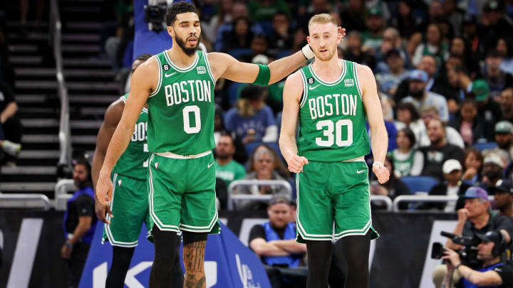 Jan 23, 2023; Orlando, Florida, USA;  Boston Celtics forward Jayson Tatum (0) and forward Sam Hauser (30) react after a play against the Orlando Magic in the second quarter at Amway Center. Mandatory Credit: Nathan Ray Seebeck-USA TODAY Sports