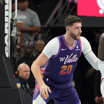 Nov 21, 2023; Phoenix, Arizona, USA; Portland Trail Blazers center Deandre Ayton (2) dribbles against Phoenix Suns center Jusuf Nurkic (20) during the first half at Footprint Center. Mandatory Credit: Joe Camporeale-Imagn Images