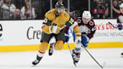 Oct 9, 2024; Las Vegas, Nevada, USA; Vegas Golden Knights center Nicolas Roy (10) skates with the puck against Colorado Avalanche center Ivan Ivan (82) during the first period at T-Mobile Arena. Mandatory Credit: Lucas Peltier-Imagn Images