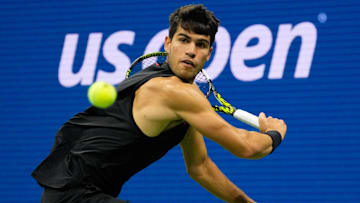 Aug 29, 2024; Flushing, NY, USA;  Carlos Alcaraz of Spain hits to Botic van De Zandschulp of the Netherlands