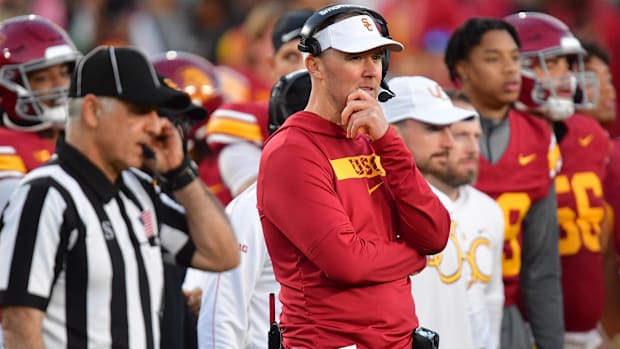 Nov 16, 2024; Los Angeles, California, USA; Southern California Trojans head coach Lincoln Riley watches game action against