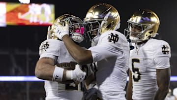 Nov 29, 2025; Stanford, California, USA;  Notre Dame Fighting Irish running back Aneyas Williams (22) celebrates with Notre Dame Fighting Irish tight end Ty Washington (7) after scoring a touchdown during the fourth quarter against the Stanford Cardinal at Stanford Stadium. 