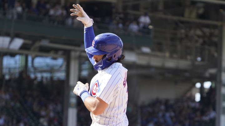 Aug 7, 2024; Chicago, Illinois, USA; Chicago Cubs shortstop Dansby Swanson (7) gestures after hitting a one run single against the Minnesota Twins during the seventh inning at Wrigley Field.