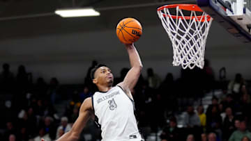Millennium forward Cameron Holmes (3) dunks against Sunnyslope during a game at Millennium High School in Goodyear on Jan. 23, 2025.