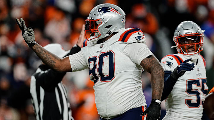 Dec 24, 2023; Denver, Colorado, USA; New England Patriots defensive tackle Christian Barmore (90) reacts after a play ]in the third quarter against the Denver Broncos at Empower Field at Mile High. Mandatory Credit: Isaiah J. Downing-Imagn Images
