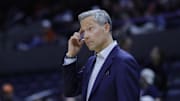 Nov 28, 2025; Charlottesville, Virginia, USA; Virginia Cavaliers head coach Ryan Odom reacts after a call against the Queens University of Charlotte Royals during the first half at John Paul Jones Arena. Mandatory Credit: Amber Searls-Imagn Images
