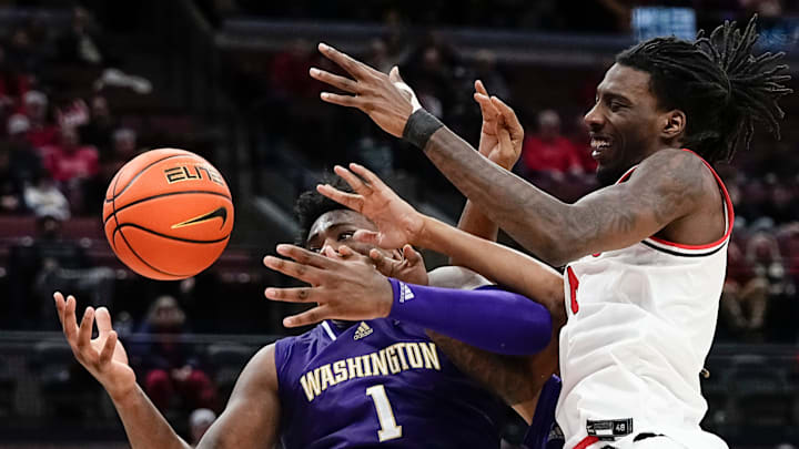 Ohio State Buckeyes forward Aaron Bradshaw (4) fights for a rebound with Washington Huskies forward Great Osobor (1) during the second half of the NCAA men's basketball game at Value City Arena in Columbus on Feb. 12, 2025. Ohio State won 93-69.