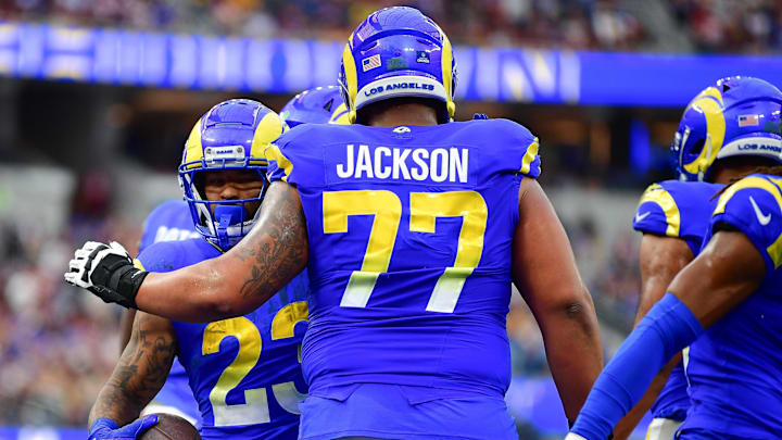 Dec 17, 2023; Inglewood, California, USA; Los Angeles Rams running back Kyren Williams (23) celebrates his touchdown scored against the Washington Commanders with offensive tackle Alaric Jackson (77) during the first half at SoFi Stadium. Mandatory Credit: Gary A. Vasquez-Imagn Images