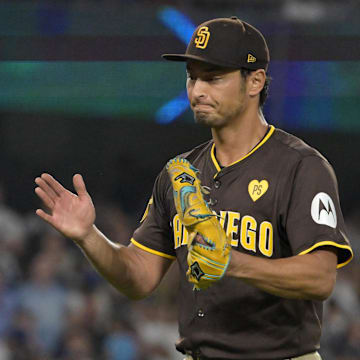 Oct 6, 2024; Los Angeles, California, USA; San Diego Padres pitcher Yu Darvish (11) reacts after an out in the seventh inning against the Los Angeles Dodgers during game two of the NLDS for the 2024 MLB Playoffs at Dodger Stadium. Mandatory Credit: Jayne Kamin-Oncea-Imagn Images