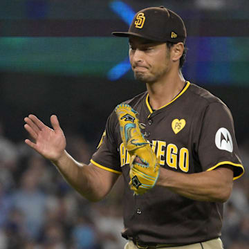 Oct 6, 2024; Los Angeles, California, USA; San Diego Padres pitcher Yu Darvish (11) reacts after an out in the seventh inning against the Los Angeles Dodgers during game two of the NLDS for the 2024 MLB Playoffs at Dodger Stadium. Mandatory Credit: Jayne Kamin-Oncea-Imagn Images