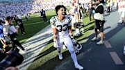 Evan Williams celebrates after the Packers beat the Texans.