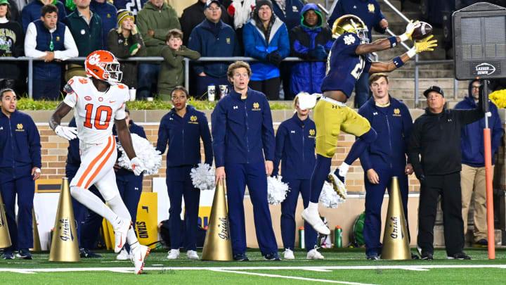 Nov 5, 2022; South Bend, Indiana, USA; Notre Dame Fighting Irish cornerback Benjamin Morrison (20) intercepts a pass intended for Clemson Tigers wide receiver Joseph Ngata (10) in the fourth quarter at Notre Dame Stadium. Morrison returned the interception for a touchdown. Notre Dame won 35-14. Mandatory Credit: Matt Cashore-USA TODAY Sports